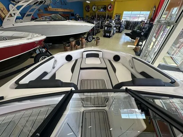 Slide: The Image of 2024 Yamaha Boats 195S interior, showroom display with sleek seating and modern design. - 6