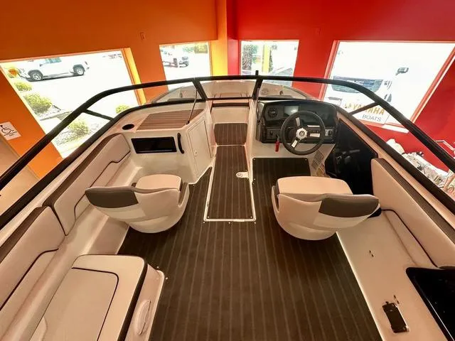Slide: The Image of 2024 Yamaha Boats SX190 interior with sleek seating and modern dashboard. - 4