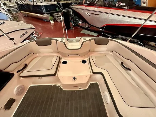 Slide: The Image of 2024 Yamaha Boats SX190 interior seating area with cup holders and cushioned seats. - 6