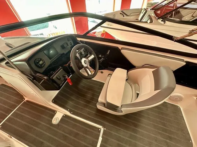 Slide: The Image of 2024 Yamaha Boats SX190 cockpit with steering wheel and seating. - 9