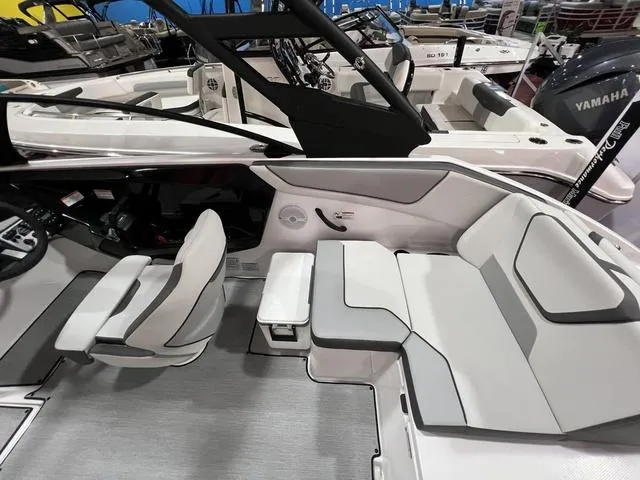 Slide: The Image of 2025 Yamaha Boats AR220 interior with sleek seating and modern design. - 12
