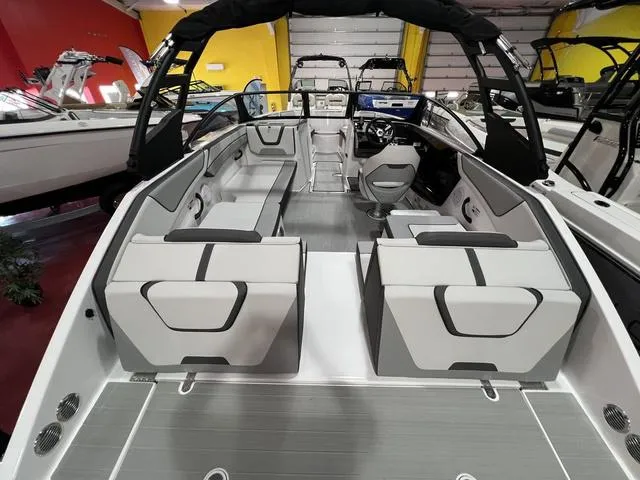 Slide: The Image of 2025 Yamaha Boats AR220 interior with sleek seating and modern design. - 13