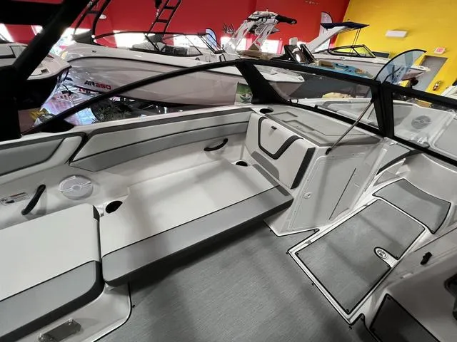 Slide: The Image of 2025 Yamaha Boats AR220 interior, sleek design, spacious seating, modern features. - 8