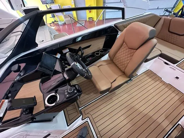 Slide: The Image of 2025 Yamaha Boats 222S interior with luxurious seating and modern dashboard design. - 10