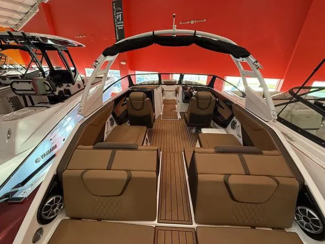 Slide: The Image of 2025 Yamaha Boats 222S interior with luxurious seating and sleek design. - 15