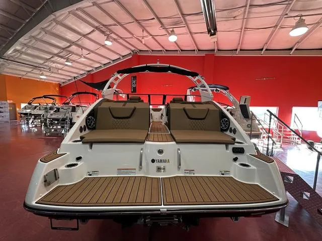 Slide: The Image of 2025 Yamaha Boats 222S in showroom, featuring sleek design and comfortable seating. - 4