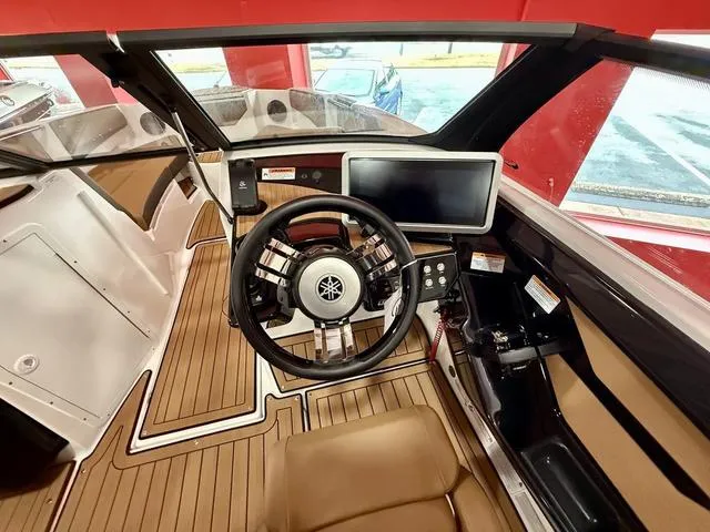Slide: The Image of 2025 Yamaha Boats 222SD cockpit with steering wheel and modern dashboard display. - 9