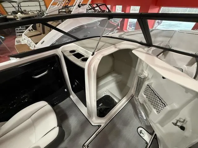 Slide: The Image of 2025 Yamaha Boats AR250 interior with seating and storage compartments. - 11