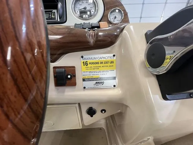 Slide: The Image of 2007 Harris Classic 240 I/O boat dashboard with capacity label for 16 persons or 2257 lbs. - 12