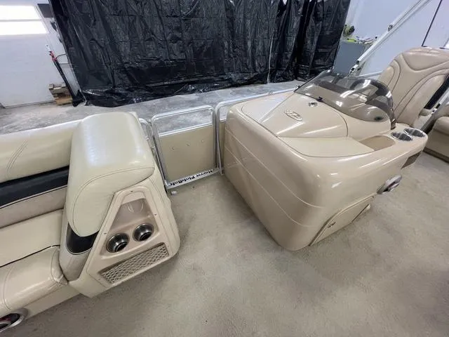 Slide: The Image of Interior of 2007 Harris Classic 240 I/O boat with beige seating and console. - 19