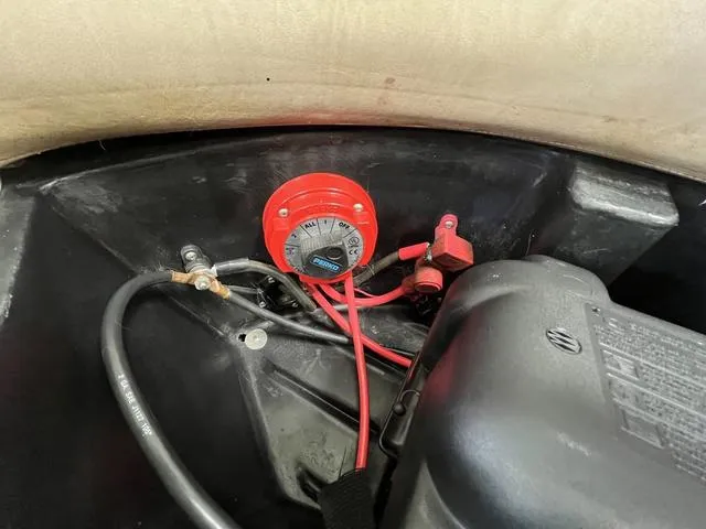 Slide: The Image of 2007 Harris Classic 240 I/O boat engine compartment with battery switch and wiring. - 20