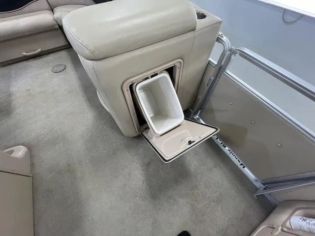 Slide: The Image of 2007 Harris Classic 240 I/O boat interior with built-in storage compartment. - 24