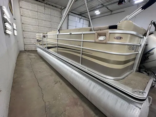 Slide: The Image of 2007 Harris Classic 240 I/O pontoon boat in a storage facility. - 5