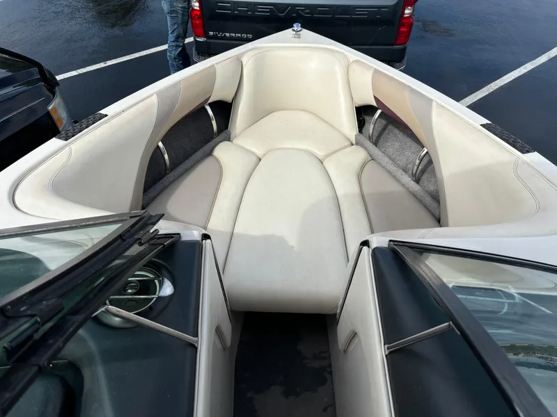 Slide: The Image of 2007 Malibu iRide boat interior with beige seating and sleek design. - 7