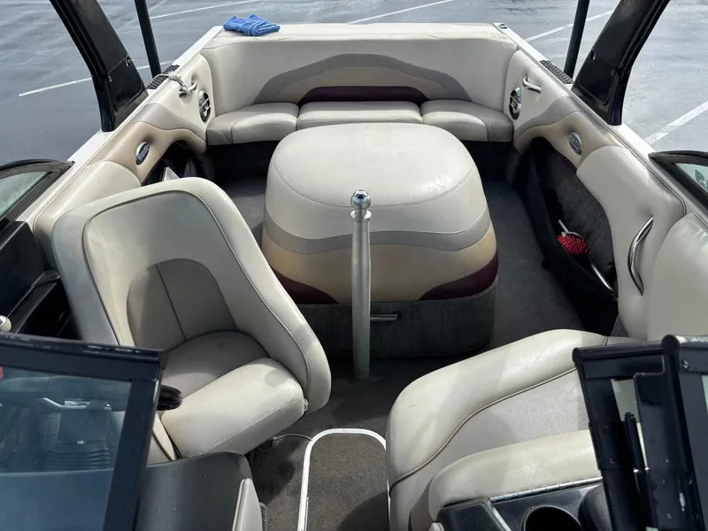 Slide: The Image of 2007 Malibu iRide boat interior with beige seating and open layout. - 8