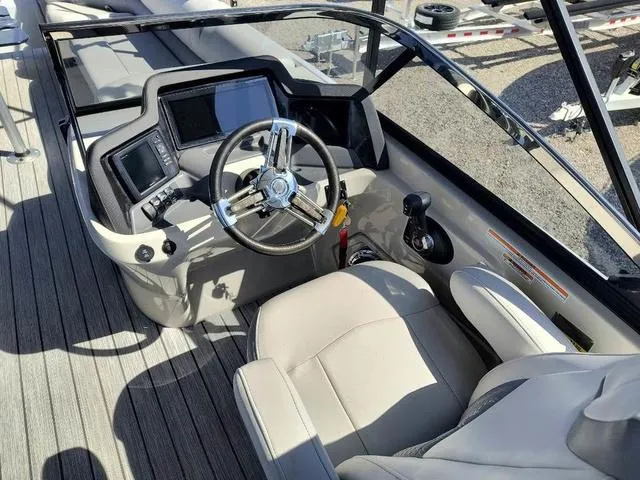 Slide: The Image of 2018 Avalon Excalibur Quad Lounge Windshield 27' boat interior with luxurious seating. - 13