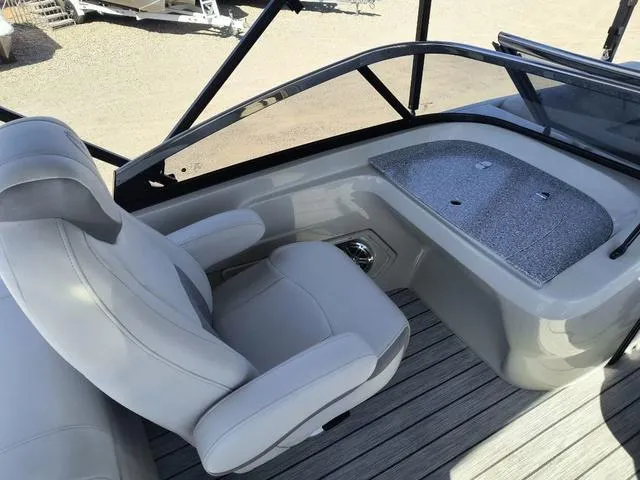 Slide: The Image of 2018 Avalon Excalibur Quad Lounge Windshield 27' boat with spacious seating and sleek design. - 14