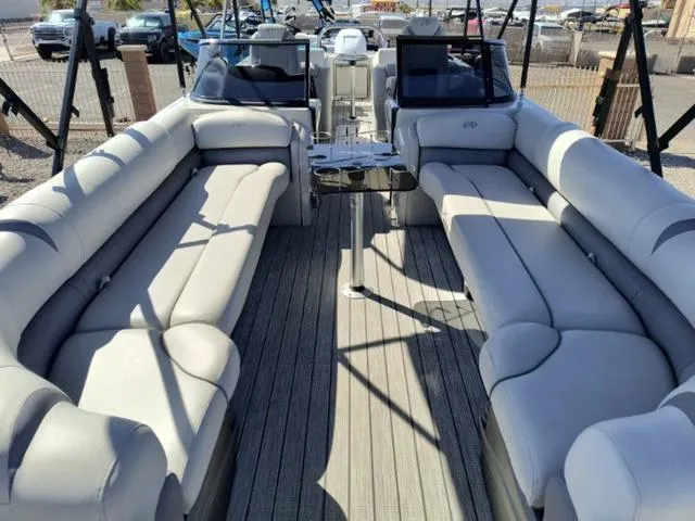 Slide: The Image of 2018 Avalon Excalibur Quad Lounge Windshield 27' cruising on water. - 16