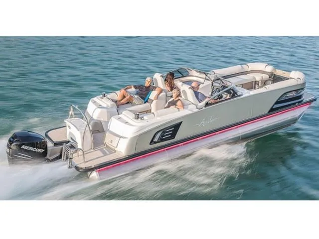 Slide: The Image of 2018 Avalon Excalibur Quad Lounge Windshield 27' pontoon boat cruising on water. - 21