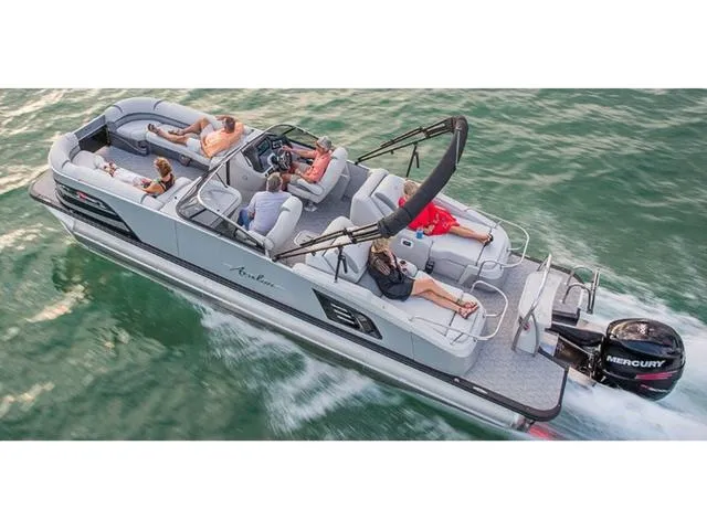 Slide: The Image of 2018 Avalon Excalibur Quad Lounge Windshield 27' pontoon boat cruising on water. - 22