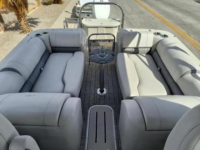 Slide: The Image of Luxurious 2018 Avalon Excalibur Quad Lounge boat with plush seating and sleek design. - 30