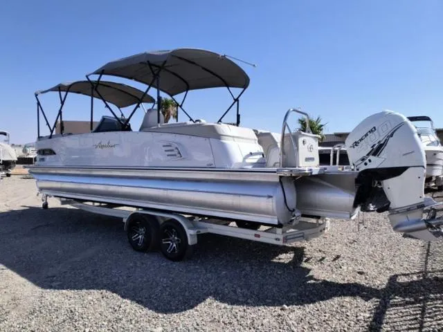 Slide: The Image of 2018 Avalon Excalibur Quad Lounge boat interior with steering wheel and dashboard. - 8