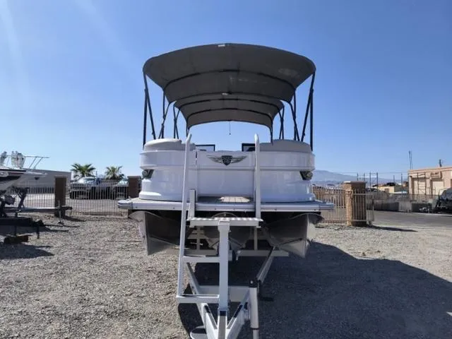 Slide: The Image of 2018 Avalon Excalibur Quad Lounge Windshield 27' boat interior with captain's chair and dashboard. - 9