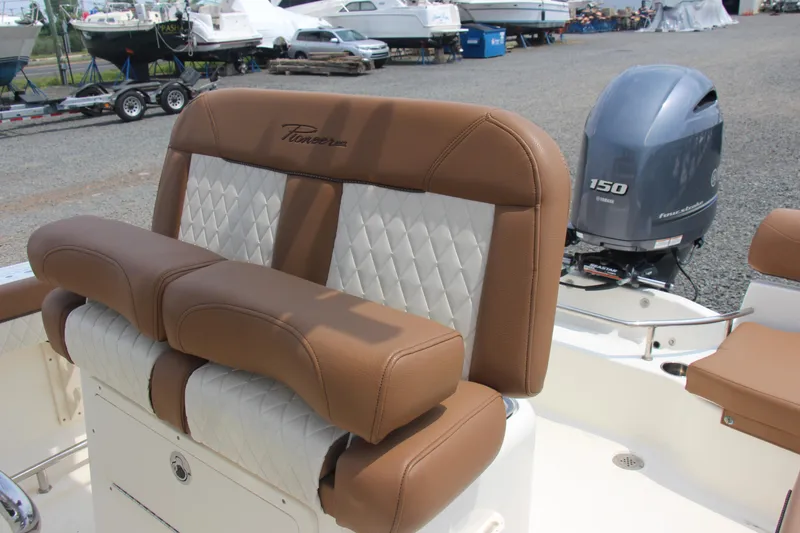 Slide: The Image of 2022 Pioneer 202 Sportfish boat with brown and white seating, Yamaha 150 engine. - 10