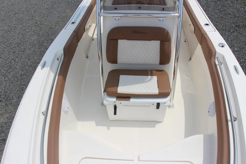 Slide: The Image of 2022 Pioneer 202 Sportfish boat interior with cushioned seating and sleek design. - 12