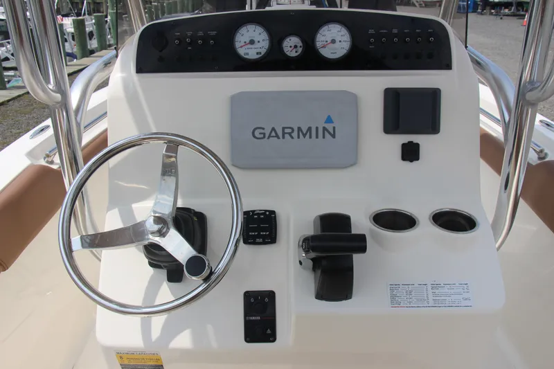 Slide: The Image of Pioneer 202 Sportfish 2022 boat console with Garmin navigation system and steering wheel. - 8