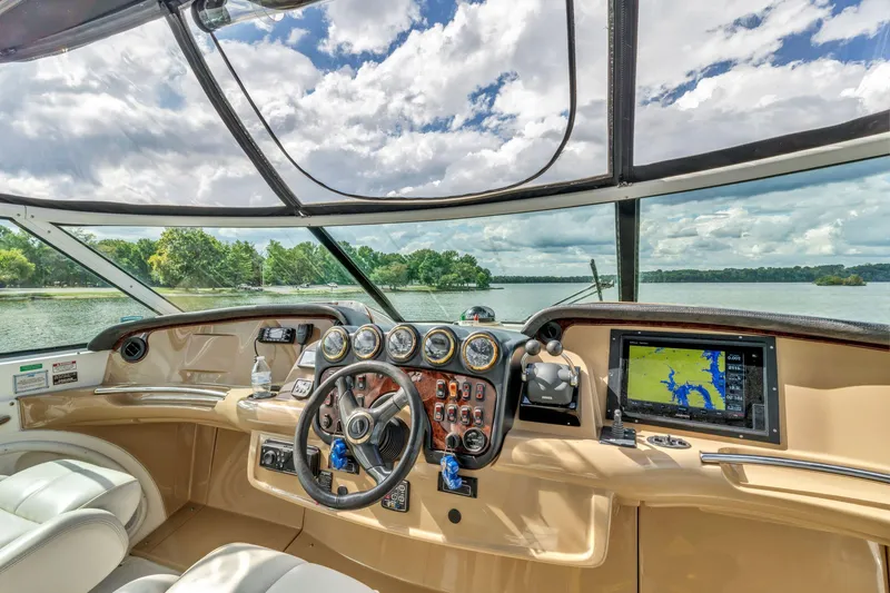 Slide: The Image of Interior helm of 2004 Carver 466 Motor Yacht with navigation system and scenic lake view. - 14