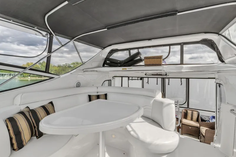 Slide: The Image of Interior of 2004 Carver 466 Motor Yacht with seating and table. - 18