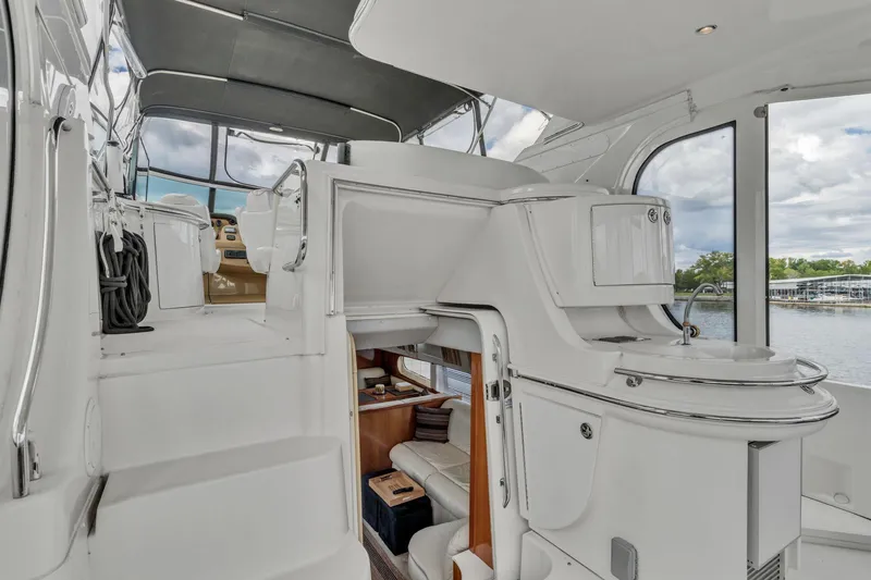Slide: The Image of 2004 Carver 466 Motor Yacht interior with modern design and spacious seating area. - 22