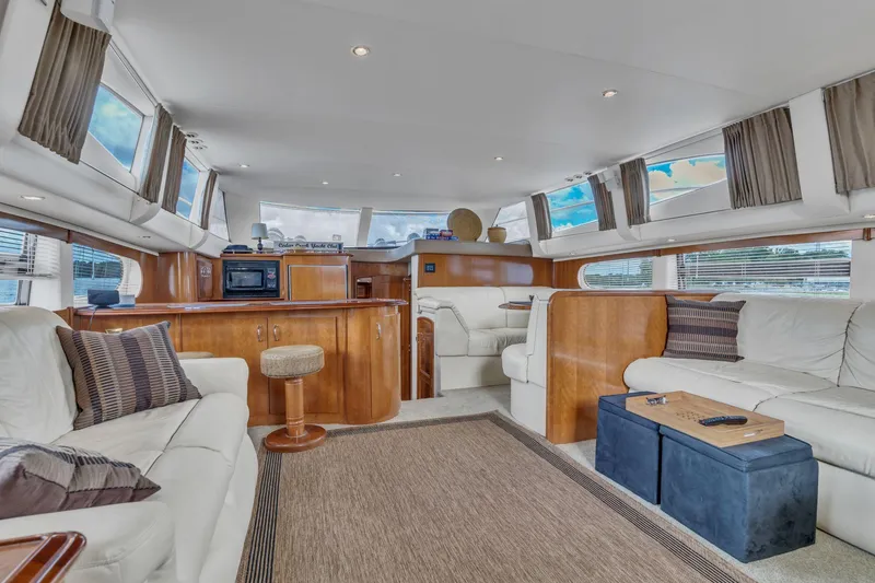 Slide: The Image of Luxurious interior of 2004 Carver 466 Motor Yacht with elegant seating and modern amenities. - 24