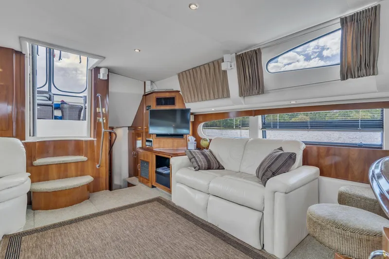 Slide: The Image of Luxurious interior of 2004 Carver 466 Motor Yacht with plush seating and modern amenities. - 25