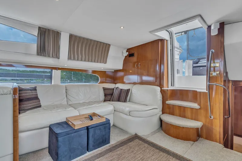 Slide: The Image of Luxurious interior of 2004 Carver 466 Motor Yacht with plush seating and elegant wood finishes. - 26