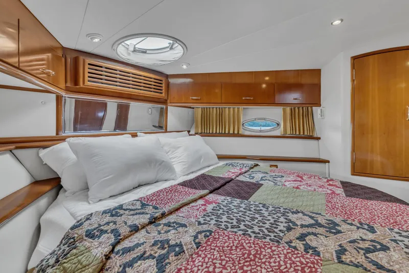 Slide: The Image of Luxurious bedroom interior of 2004 Carver 466 Motor Yacht with quilted bedding. - 39