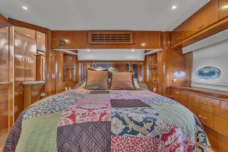 Slide: The Image of Luxurious bedroom interior of 2004 Carver 466 Motor Yacht with elegant wood finish. - 48