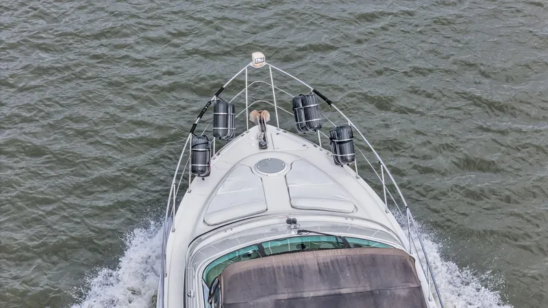 Slide: The Image of Top view of 2004 Carver 466 Motor Yacht cruising on water. - 6
