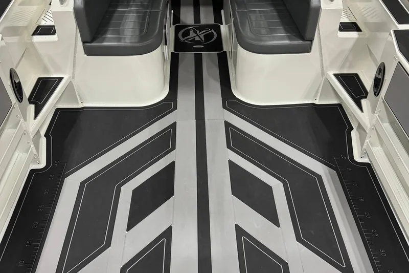 Slide: The Image of Interior view of 2025 Extreme Boats 915 Walk Around, featuring sleek seating and modern flooring design. - 2