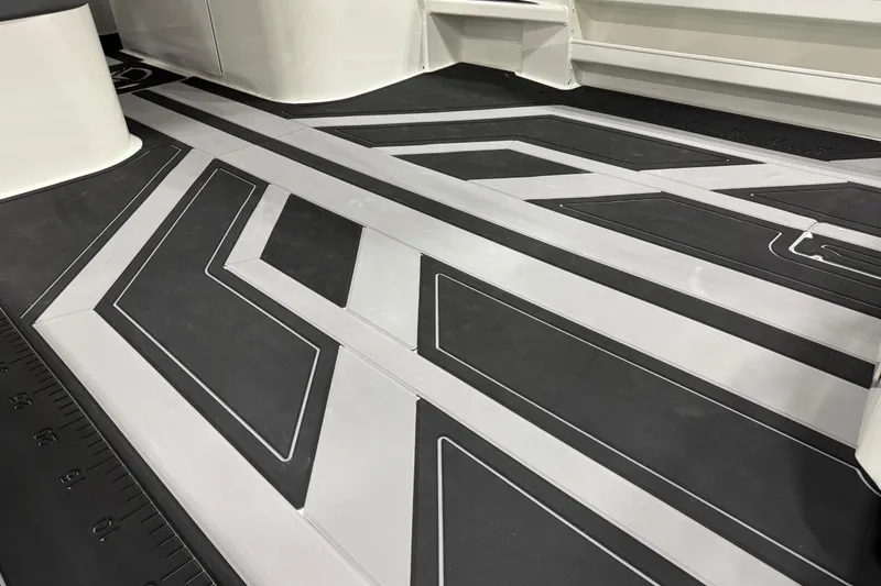 Slide: The Image of 2025 Extreme Boats 915 Walk Around 30' deck with sleek geometric design. - 3