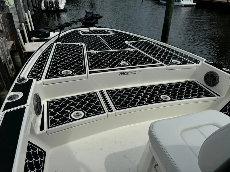 Slide: The Image of 2024 Pathfinder 2500 Hybrid boat with stylish black and white deck design. - 9