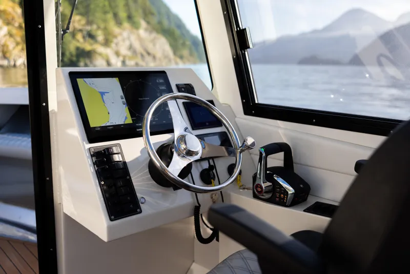 Slide: The Image of Jasper Marine Defender 22 cockpit, 2025 model, featuring modern navigation and control systems. - 43