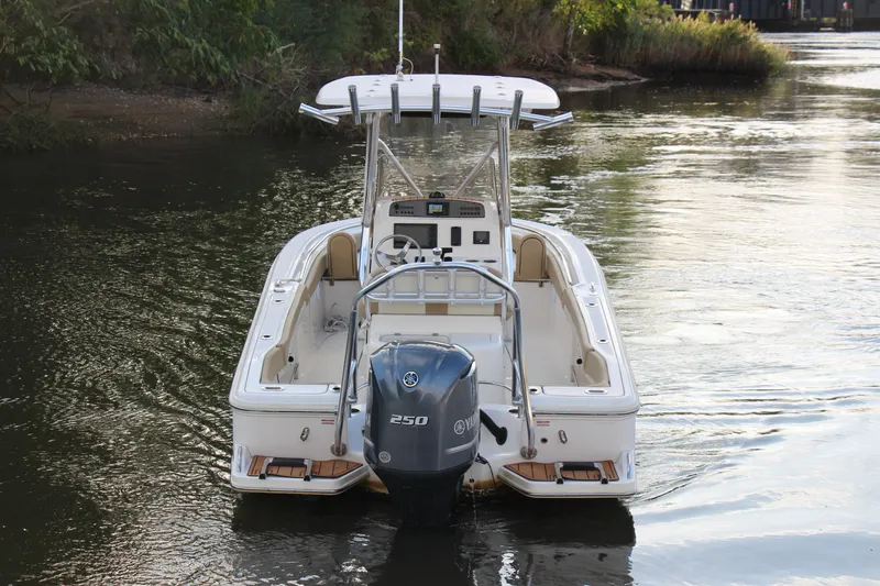 Slide: The Image of 2020 Pioneer 222 Sportfish boat with Yamaha 250 engine on calm water. - 1