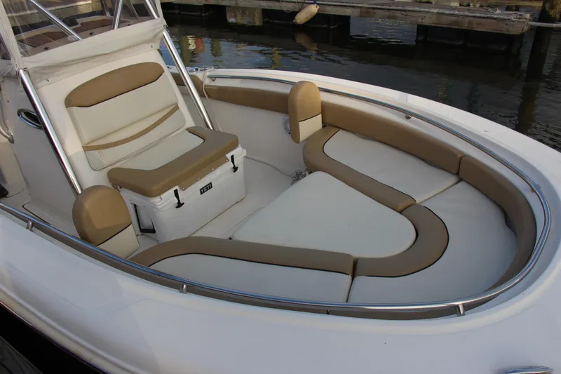 Slide: The Image of 2020 Pioneer 222 Sportfish boat with spacious seating and sleek design. - 11
