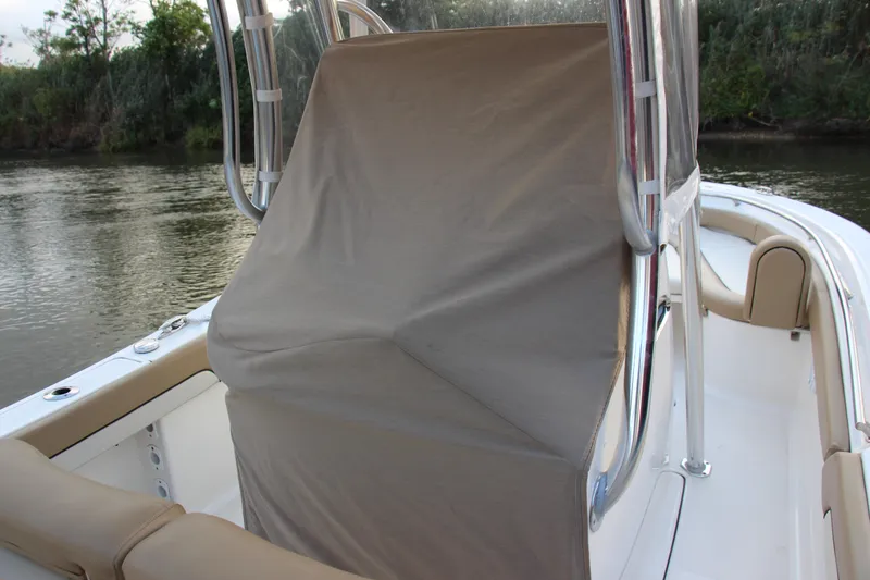 Slide: The Image of 2020 Pioneer 222 Sportfish boat with covered console on calm water. - 14