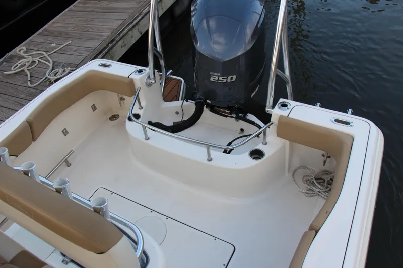 Slide: The Image of 2020 Pioneer 222 Sportfish boat with Yamaha 250 engine, docked by wooden pier. - 17
