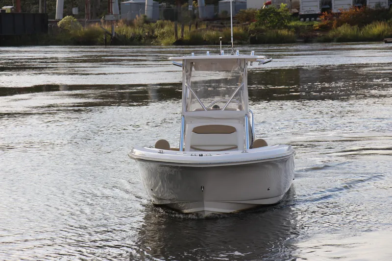 Slide: The Image of 2020 Pioneer 222 Sportfish boat on calm water, front view. - 2
