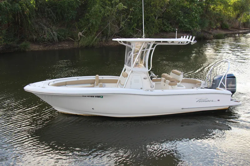 Slide: The Image of 2020 Pioneer 222 Sportfish boat on calm river water. - 7