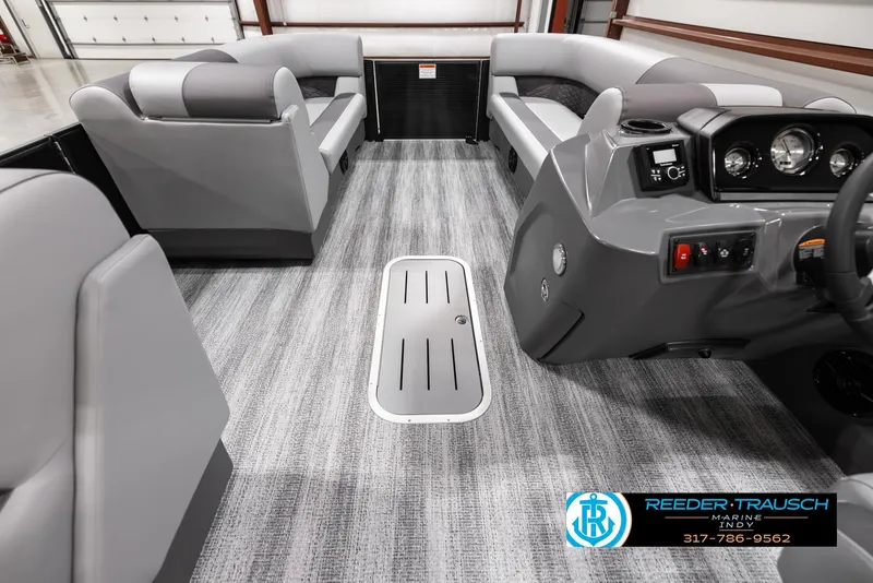 Slide: The Image of 2025 Bennington 21 SL pontoon boat interior with modern seating and dashboard. - 18
